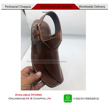 Hush puppies crocs Zalmi Peshawari chappal on wooden background Stock Photo  - Alamy